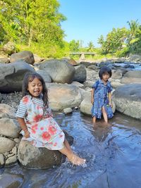 Sisters enjoying in river