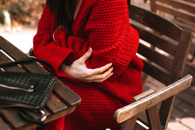 Midsection of woman using laptop