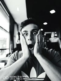 Portrait of young man in restaurant