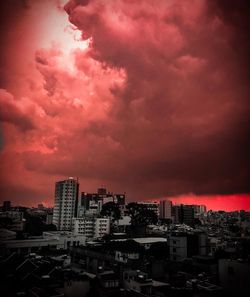 High angle view of buildings against dramatic sky