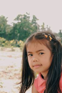 Portrait of smiling girl with long hair