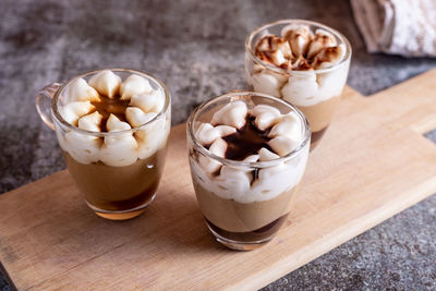 Assortment of mini chocolate desserts in the glass. mini choloate desserts on a rustic background