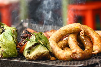 Close-up of meat on barbecue grill