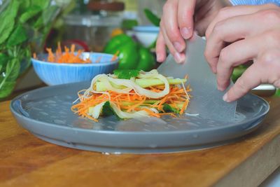 Close-up of woman preparing food