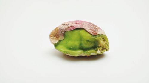 Close-up of green pepper against white background