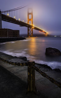 View of suspension bridge at dusk