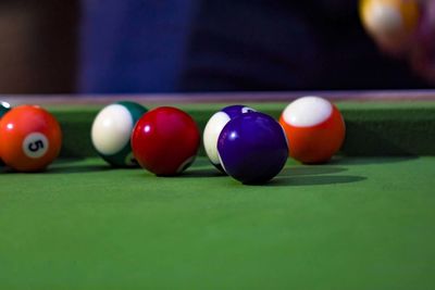 Close-up of multi colored balls on table