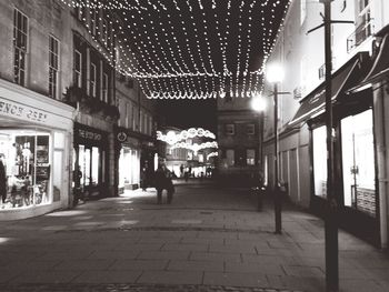 Full length of woman in illuminated city