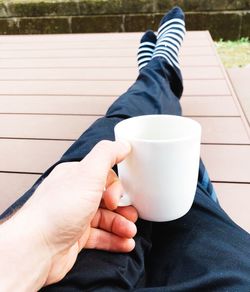 Low section of man with coffee