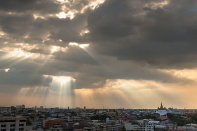 Aerial view of town against sky during sunset