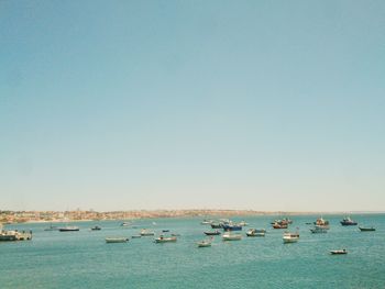 Scenic view of sea against clear blue sky