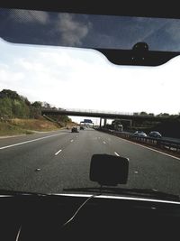 Road seen through car windshield