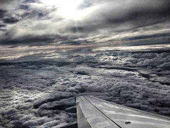 Cropped image of landscape against cloudy sky