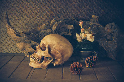 High angle view of human skull on wooden table