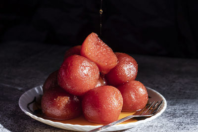 Close-up of gulab jamuns in plate on table
