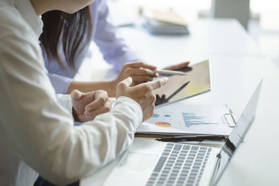 Low angle view of man working on table