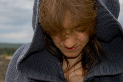 Close-up portrait of a smiling woman in winter