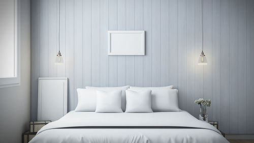 Close-up of white sofa on bed at home