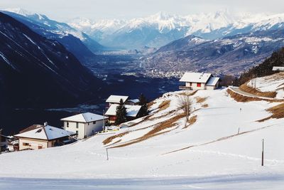 Aerial view of snowcapped mountain against sky