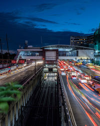 High angle view of light trails on railroad tracks at night