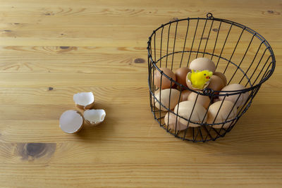 High angle view of eggs in basket on table