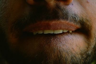 Cropped image of man mouth