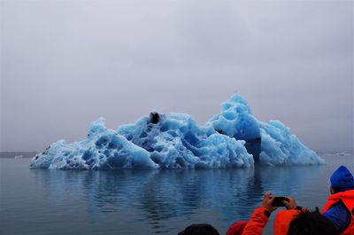 Scenic view of frozen sea against sky