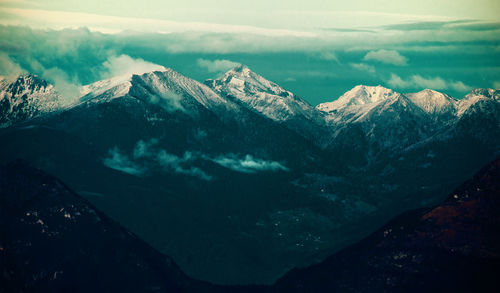 Scenic view of snow covered mountains against sky