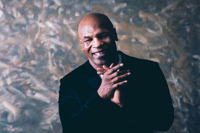 Portrait of smiling man standing outdoors