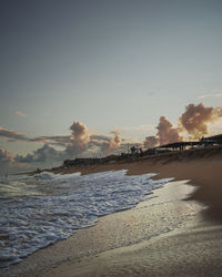 Scenic view of beach against sky during sunset