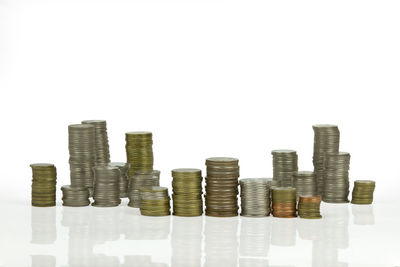 Stack of coin against white background