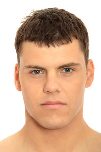 Portrait of young man against white background