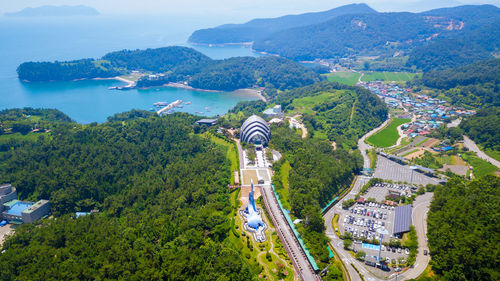 High angle view of city and trees against sky