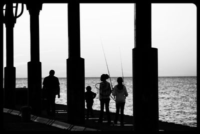 Silhouette of woman in sea