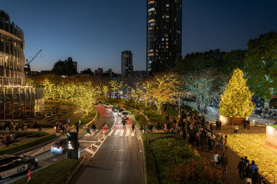 High angle view of illuminated buildings in city