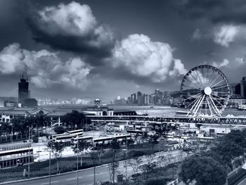 Ferris wheel against cloudy sky