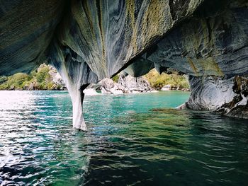 Scenic view of sea seen through cave