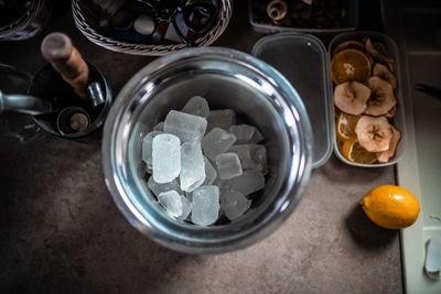 High angle view of ice in glass on table