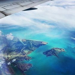 Aerial view of landscape against blue sky