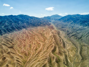 Scenic view of arid landscape against sky