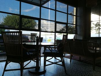 Empty chairs and tables in building