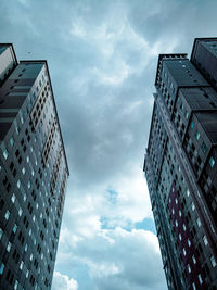 Low angle view of modern buildings against sky