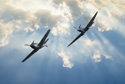 Low angle view of airplane against sky