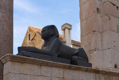 Low angle view of statue against sky