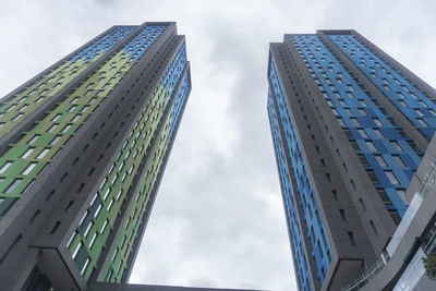 Low angle view of modern buildings against sky