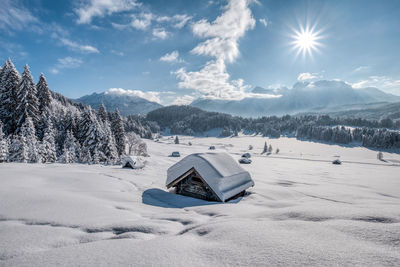 Scenic view of snow covered mountains against sky