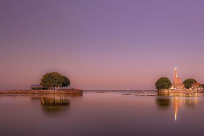 Scenic view of lake against sky during sunset