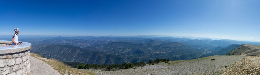 Scenic view of mountains against clear blue sky