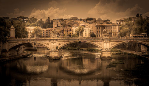 Arch bridge over against buildings