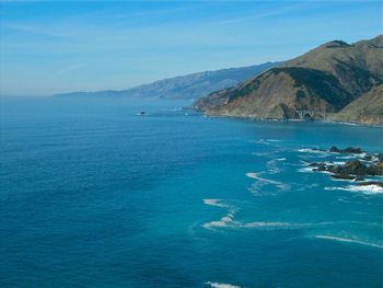 Scenic view of sea against blue sky